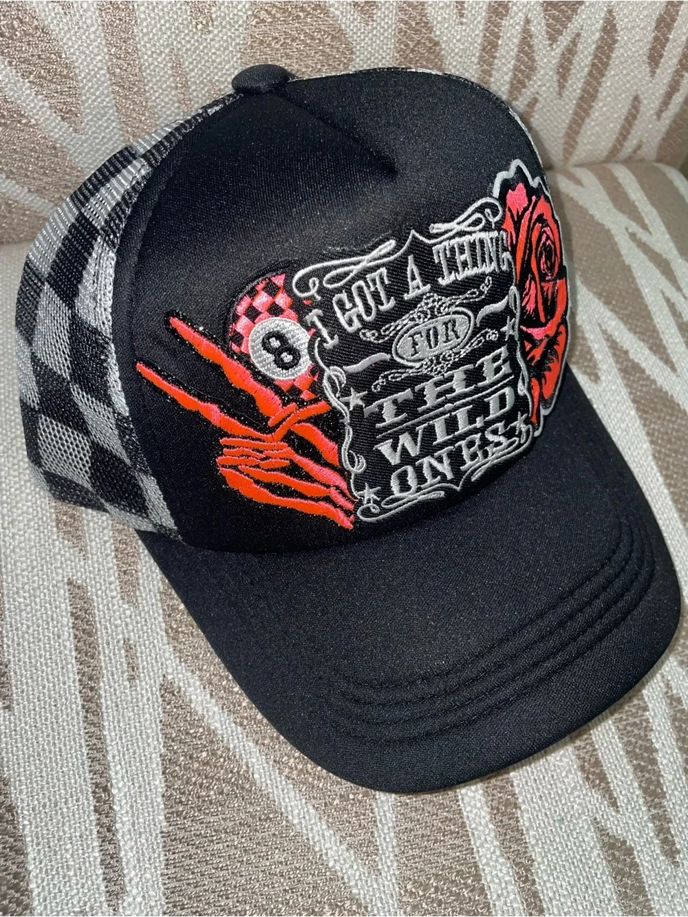 Black Graphic Trucker Hat with Red Rose & Skeleton Hand